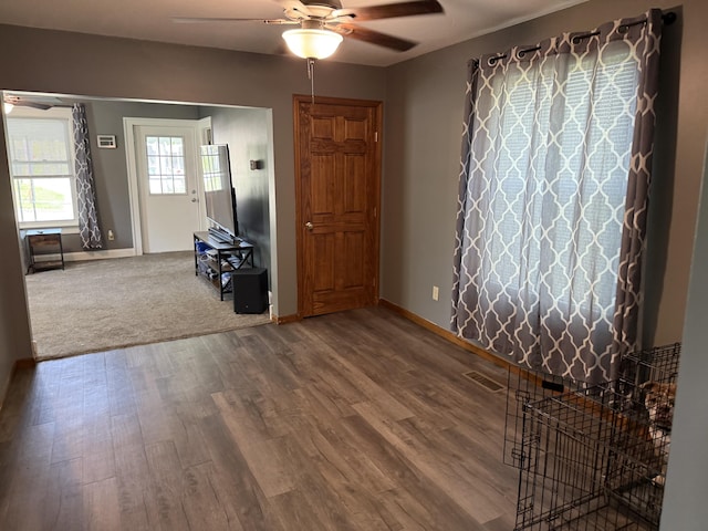 202 Kalamo St, Olivet, MI 49076 - foyer featuring a ceiling fan, baseboards, and wood finished floors