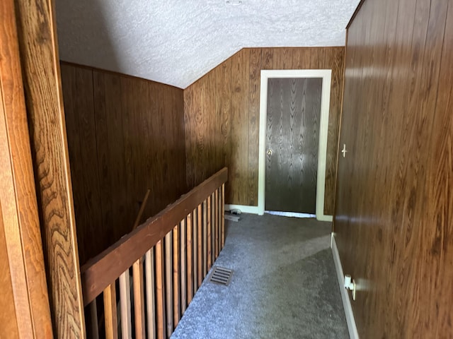 202 Kalamo St, Olivet, MI 49076 - corridor featuring a textured ceiling, carpet, and an upstairs landing