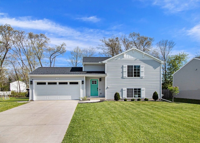 25808 Forest Ln, Mattawan, MI 49071 - split level home featuring an attached garage, concrete driveway, and a front lawn