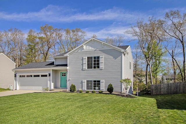 25808 Forest Ln, Mattawan, MI 49071 - tri-level home featuring a garage, concrete driveway, and roof with shingles