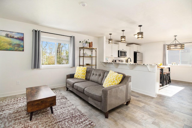 25808 Forest Ln, Mattawan, MI 49071 - living room featuring light wood finished floors and baseboards
