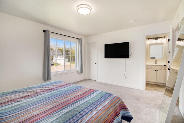 25808 Forest Ln, Mattawan, MI 49071 - bedroom featuring light colored carpet, baseboards, and connected bathroom