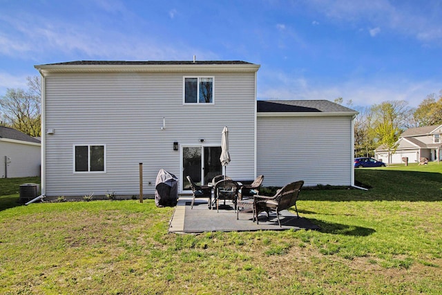 25808 Forest Ln, Mattawan, MI 49071 - back of house featuring central AC, a patio area, and a yard