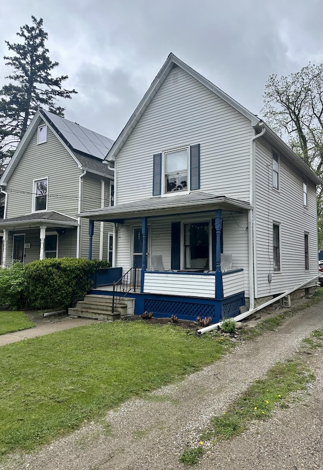 522 N Main St, Ann Arbor, MI 48104 - view of front of property with a porch and a front yard