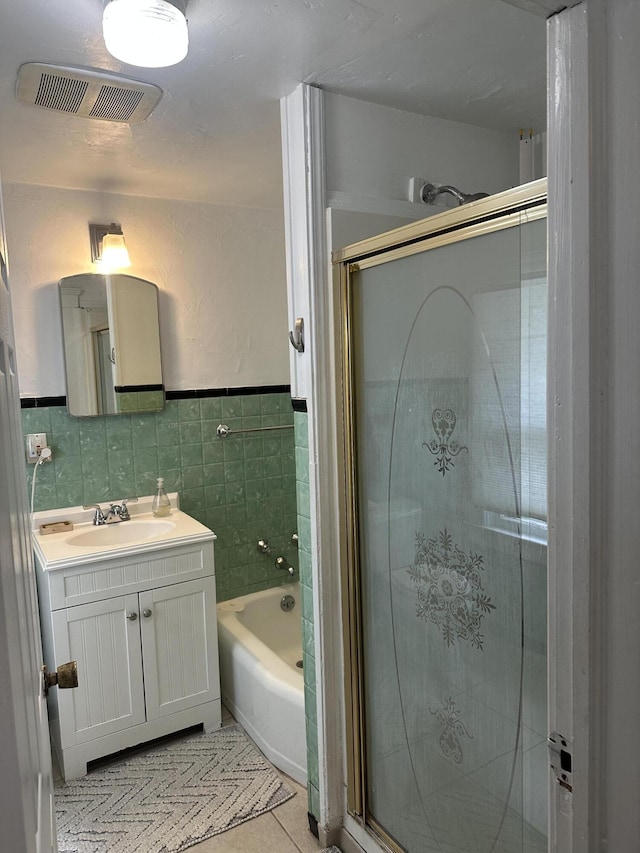 522 N Main St, Ann Arbor, MI 48104 - bathroom with a shower with shower door, tile patterned flooring, vanity, tile walls, and a tub