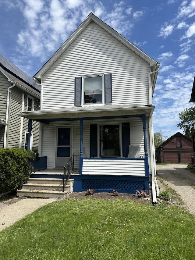 522 N Main St, Ann Arbor, MI 48104 - view of front of home with covered porch and a front lawn