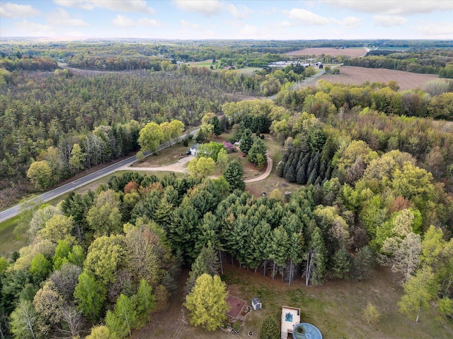 aerial overview of property's location featuring a heavily wooded area