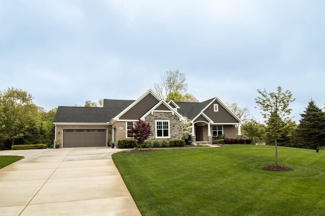 3817 Timber Green Ct, Howell, MI 48843 - craftsman-style home featuring a garage, a front yard, driveway, and stone siding