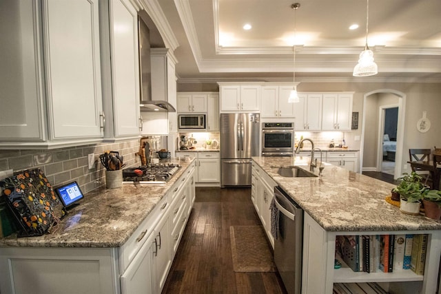 3817 Timber Green Ct, Howell, MI 48843 - kitchen with stainless steel appliances, a sink, arched walkways, ornamental molding, and white cabinets