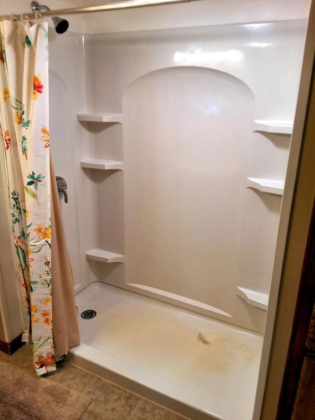 bathroom with a stall shower