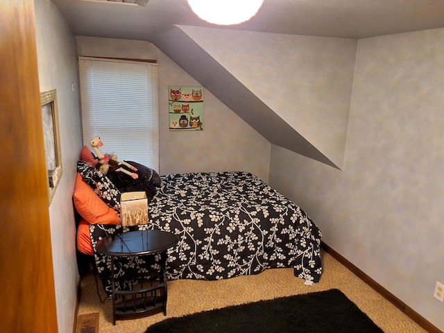 bedroom with carpet floors and baseboards