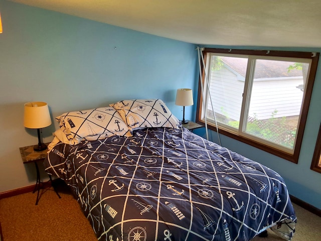 bedroom with carpet floors and baseboards