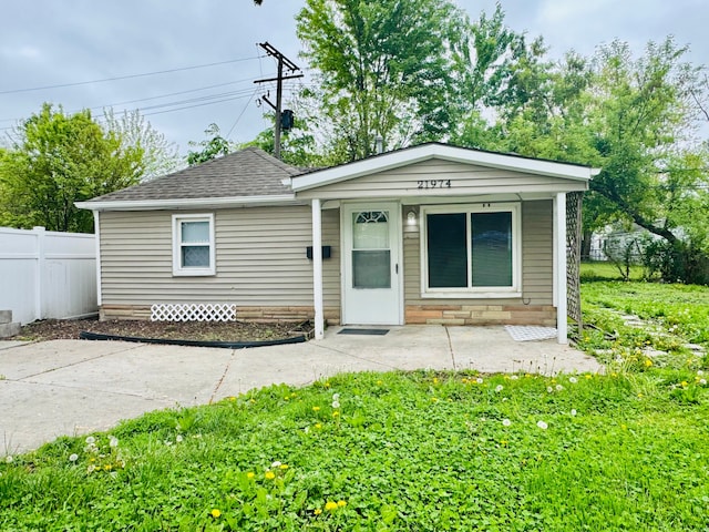 21974 Elroy Ave, Warren, MI 48089 - view of front facade featuring fence and roof with shingles