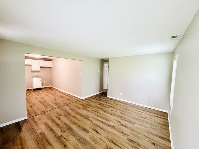 21974 Elroy Ave, Warren, MI 48089 - unfurnished living room featuring light wood-style flooring and baseboards