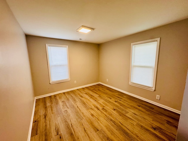 21974 Elroy Ave, Warren, MI 48089 - spare room with wood finished floors and baseboards