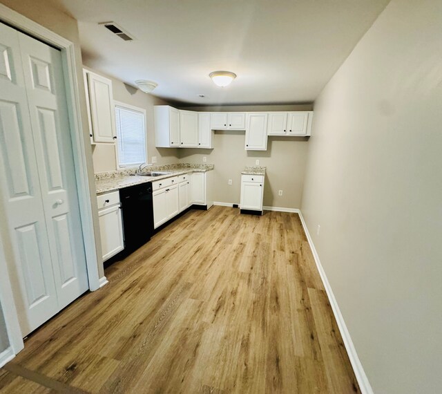 21974 Elroy Ave, Warren, MI 48089 - kitchen with dishwasher, light wood-style flooring, a sink, white cabinets, and baseboards