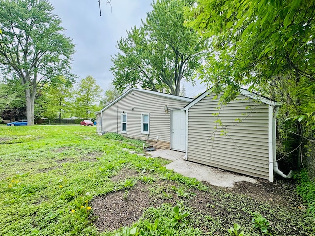 21974 Elroy Ave, Warren, MI 48089 - rear view of property featuring a yard