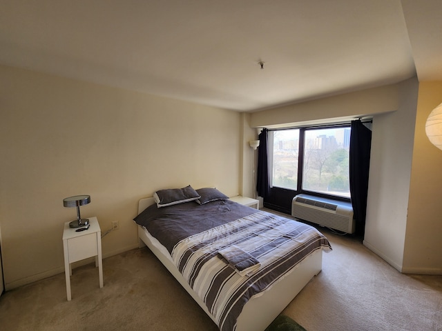 1001 W Jefferson Ave # 4D, Detroit, MI 48226 - bedroom featuring light colored carpet, baseboards, and a wall mounted air conditioner