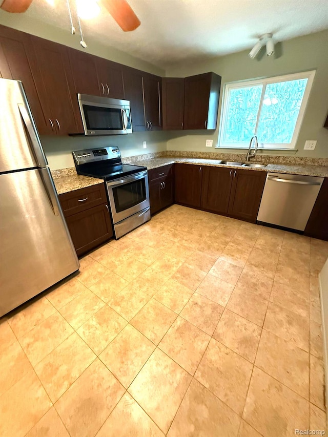 27915 Berrywood Ln Unit 72, Farmington Hills, MI 48334 - kitchen with appliances with stainless steel finishes, a sink, ceiling fan, and dark brown cabinetry