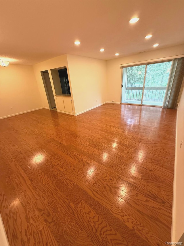 27915 Berrywood Ln Unit 72, Farmington Hills, MI 48334 - spare room featuring wood finished floors, recessed lighting, and baseboards