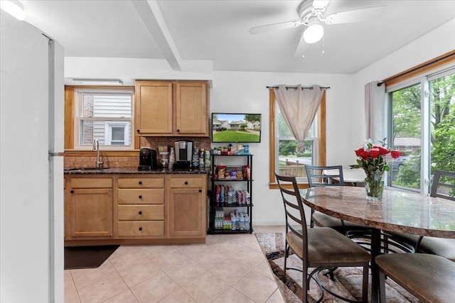dining room with light tile patterned flooring and a ceiling fan