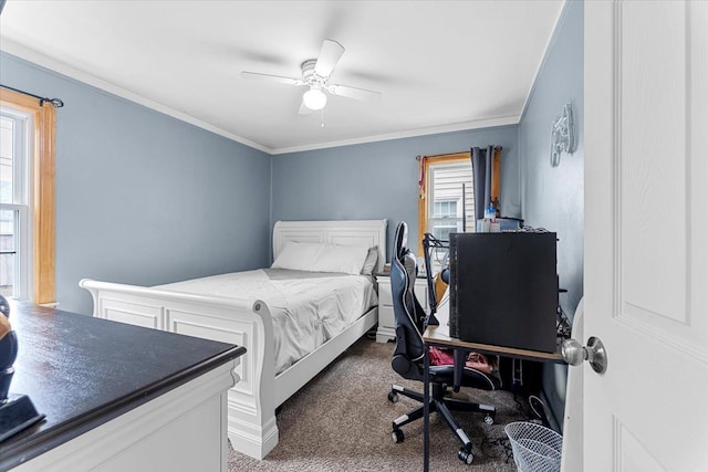 bedroom with carpet flooring, crown molding, and ceiling fan