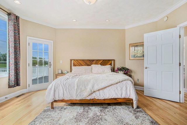 bedroom featuring multiple windows, access to outside, light wood-style flooring, baseboards, and ornamental molding