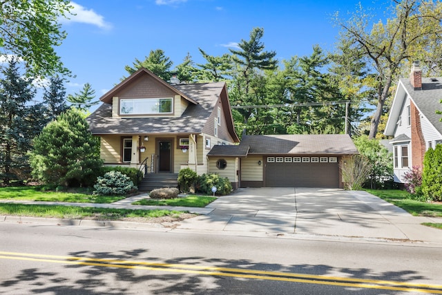 bungalow-style home featuring an attached garage and driveway