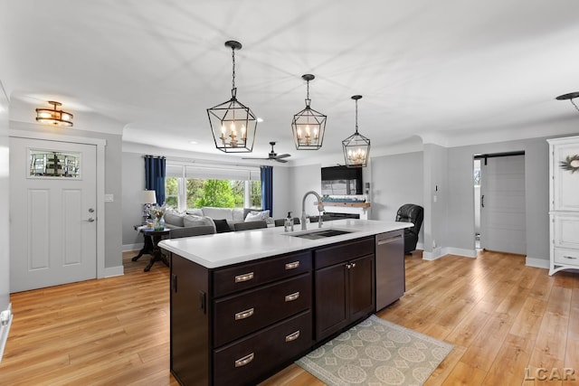 4730 Occidental Hwy, Adrian, MI 49221 - kitchen featuring a sink, stainless steel dishwasher, a chandelier, and light countertops