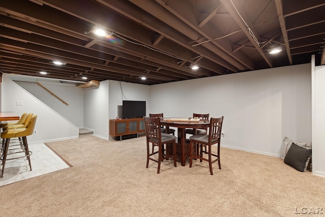 4730 Occidental Hwy, Adrian, MI 49221 - dining area featuring carpet, baseboards, and stairway