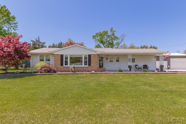 4730 Occidental Hwy, Adrian, MI 49221 - ranch-style house featuring a front lawn and brick siding