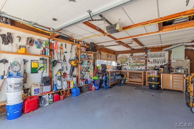 4730 Occidental Hwy, Adrian, MI 49221 - garage featuring a workshop area and a garage door opener