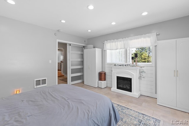 4730 Occidental Hwy, Adrian, MI 49221 - bedroom with recessed lighting and a glass covered fireplace