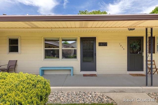 property entrance featuring covered porch