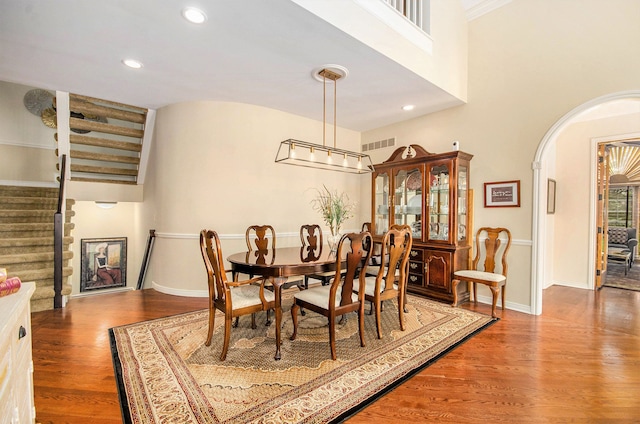 2200 Clearwood, Shelby Twp, MI 48316 - dining space with stairway, wood finished floors, arched walkways, baseboards, and recessed lighting