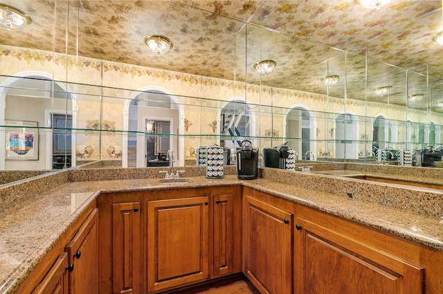 2200 Clearwood, Shelby Twp, MI 48316 - kitchen featuring a sink, brown cabinetry, and light stone counters