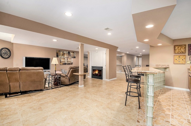 2200 Clearwood, Shelby Twp, MI 48316 - bar area featuring a warm lit fireplace, recessed lighting, baseboards, and light tile patterned floors