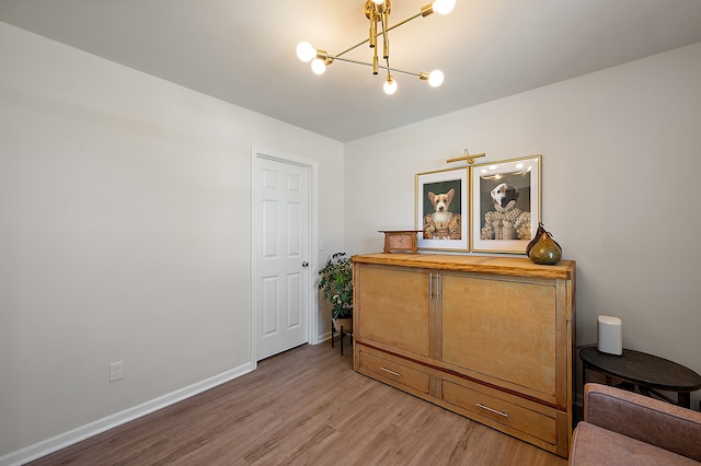 346 Quartz Way, White Lake, MI 48386 - bedroom featuring a chandelier, light wood-style floors, and baseboards