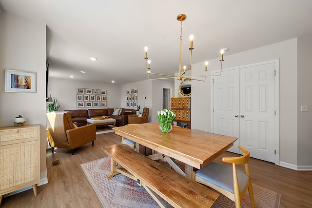 346 Quartz Way, White Lake, MI 48386 - dining room featuring light wood-type flooring, baseboards, recessed lighting, and a chandelier