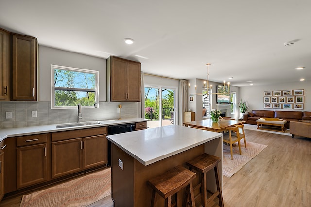 346 Quartz Way, White Lake, MI 48386 - kitchen featuring a sink, plenty of natural light, light wood-style flooring, backsplash, and recessed lighting