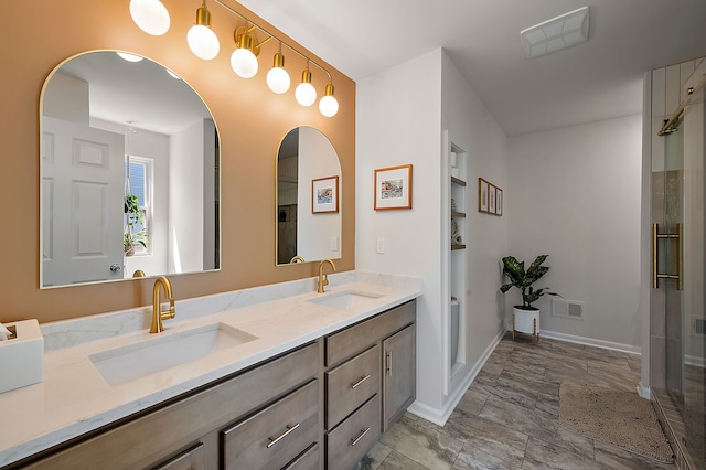 346 Quartz Way, White Lake, MI 48386 - bathroom with double vanity, a shower with door, built in features, and baseboards