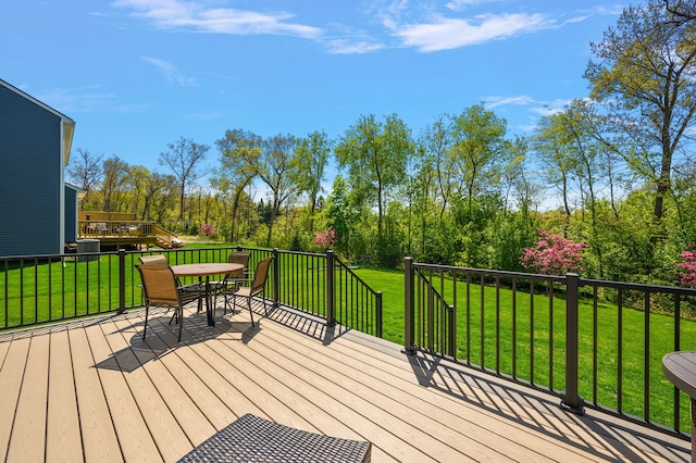 346 Quartz Way, White Lake, MI 48386 - wooden terrace featuring outdoor dining space and a lawn
