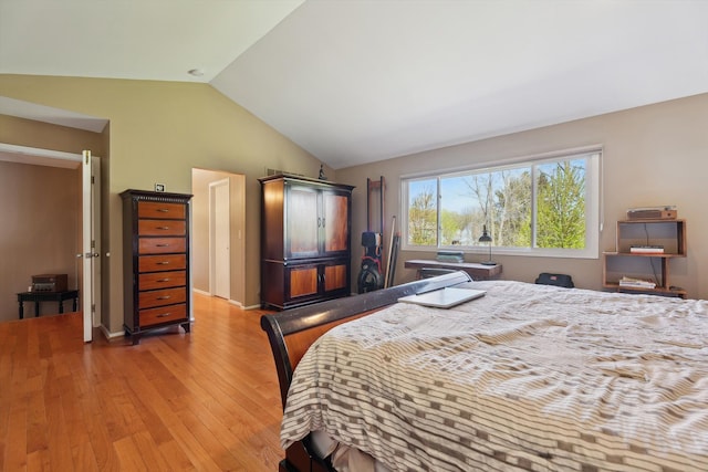 7039 Timberview Trl, West Bloomfield, MI 48322 - bedroom with light wood-style flooring and lofted ceiling