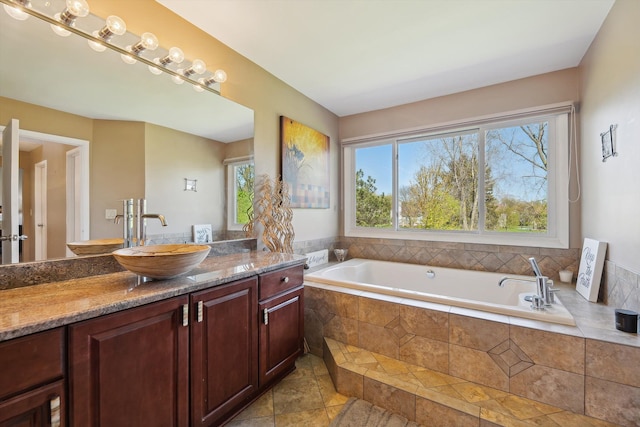 7039 Timberview Trl, West Bloomfield, MI 48322 - full bath with healthy amount of natural light, a bath, vanity, and tile patterned flooring