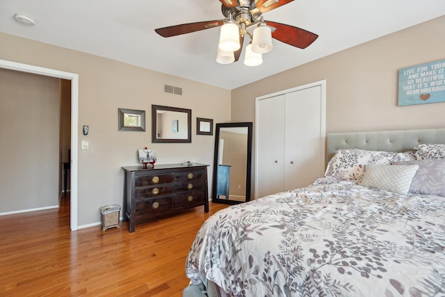 7039 Timberview Trl, West Bloomfield, MI 48322 - bedroom with light wood-style flooring, a closet, baseboards, and ceiling fan