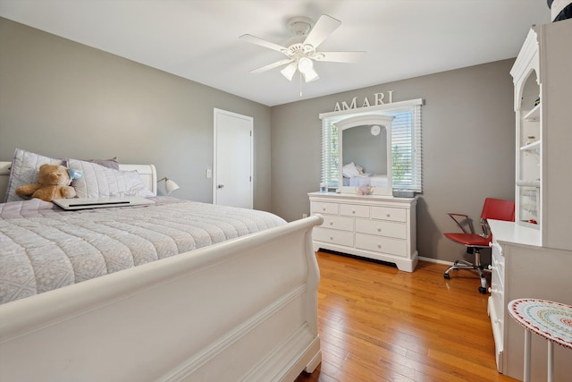 7039 Timberview Trl, West Bloomfield, MI 48322 - bedroom with light wood-style floors, a ceiling fan, and baseboards