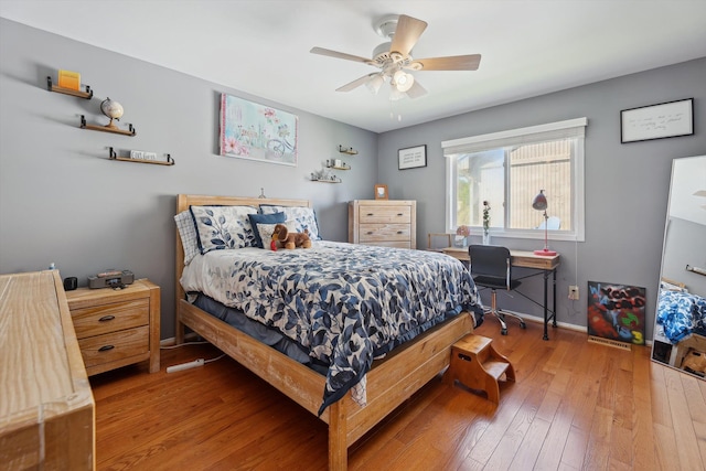 7039 Timberview Trl, West Bloomfield, MI 48322 - bedroom with hardwood / wood-style floors, baseboards, and a ceiling fan