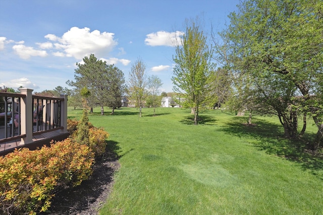 7039 Timberview Trl, West Bloomfield, MI 48322 - view of green lawn with a deck