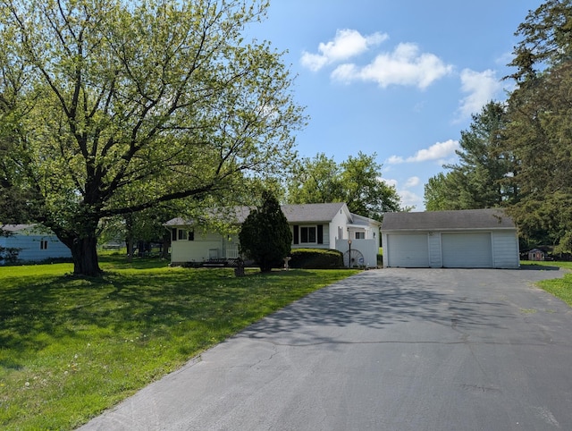 5062 Kendall Dr, Burton, MI 48509 - view of front facade featuring a detached garage and a front yard