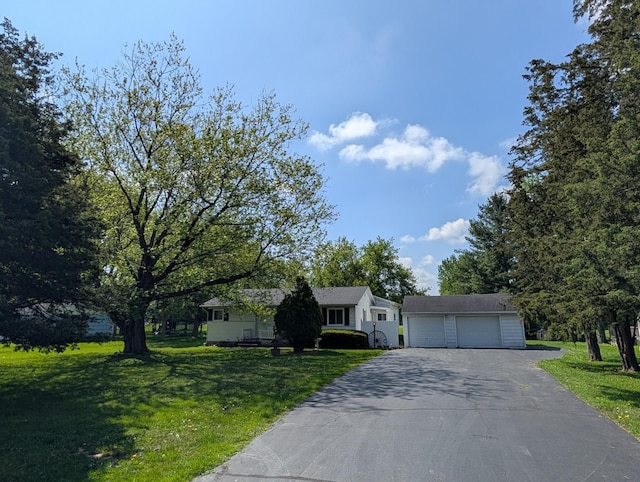 5062 Kendall Dr, Burton, MI 48509 - view of front facade with a garage, a front yard, an outdoor structure, and asphalt driveway